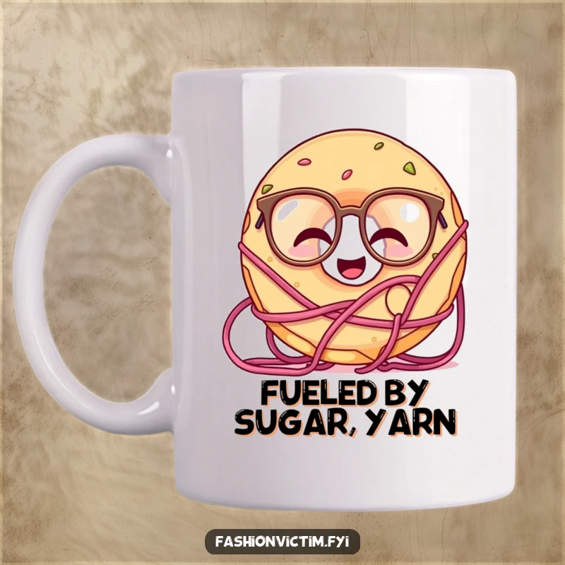 Funny doughnut mug showing a giggling doughnut wearing oversized glasses, completely tangled in colorful yarn.