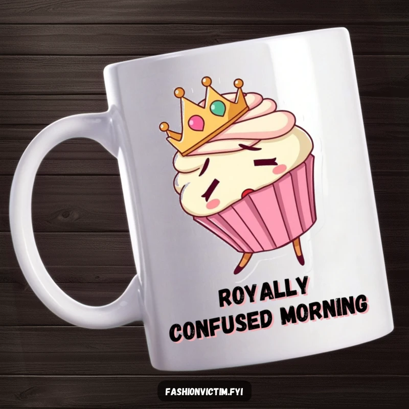 Funny mug featuring a confused cupcake wearing a tiny crown backwards and stumbling, looking bewildered.