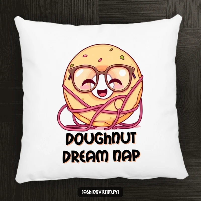 Funny decorative pillow with a giggling doughnut character wearing oversized glasses, happily tangled in yarn.