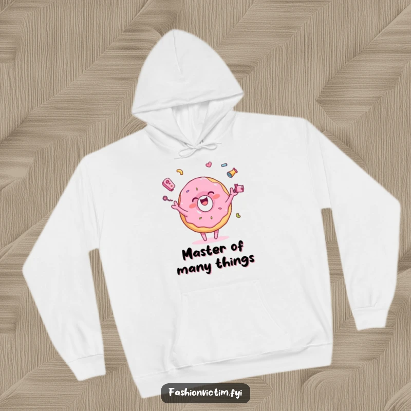 Funny hoodie featuring a pink donut character joyfully juggling tiny, colorful accessories, offering comfort and a cheerful design.