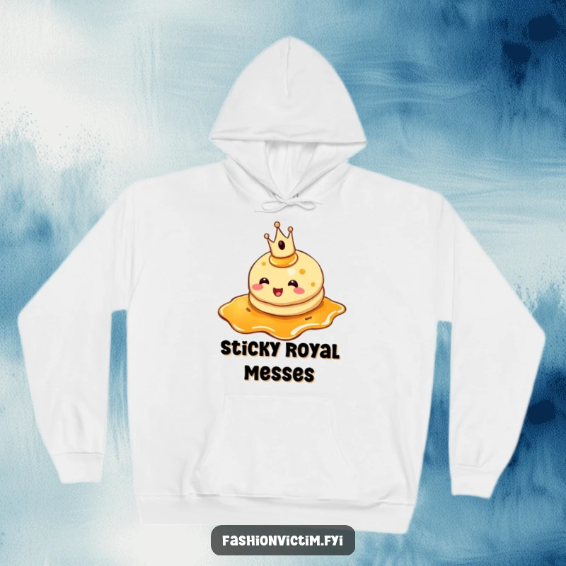Funny pancake hoodie, a cheerful pancake wearing a tiny crown, tripping over syrup, cozy and warm.