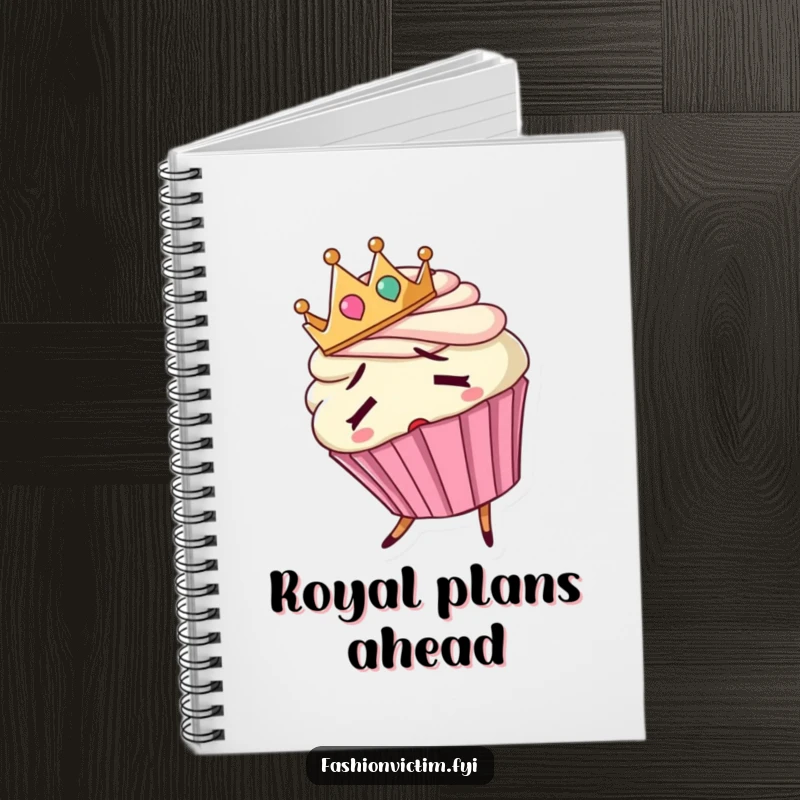 Funny notebook with a confused cupcake wearing a backward crown and tripping, ready for notes.